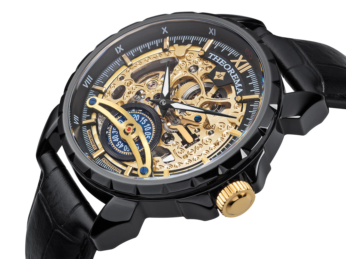 Engraved gold color dial with Roman numerals on the black bezel. An engraved circled crown.