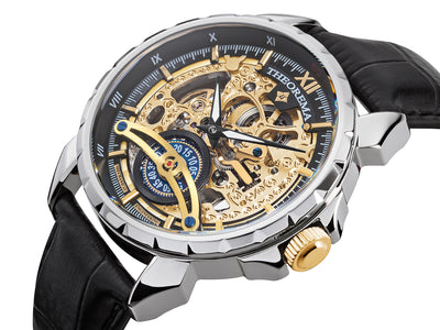 Engraved gold color dial with Roman numerals on the black bezel. An engraved circled crown.