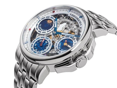 Silver stainless steel, stainless steel case, see through movement with silver crown.