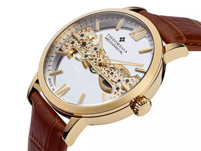 Gold case with gold crown button and a genuine brown leather band.