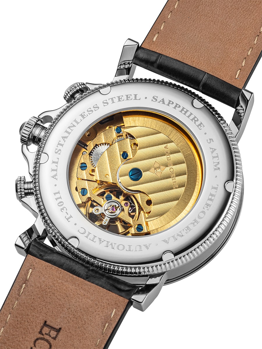 Self-winding automatic gold color movement is encased in stainless steel.