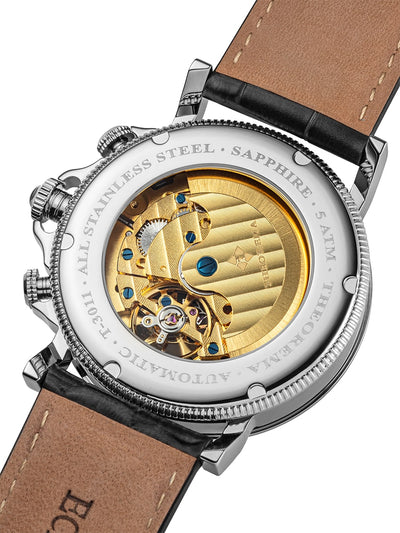 Self-winding automatic gold color movement is encased in stainless steel.
