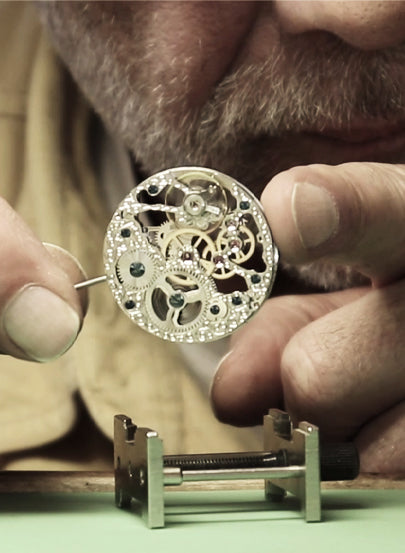 Tufina's watchmaker working at the laboratory in Munich, Germany. Hand assembly of the watch.
